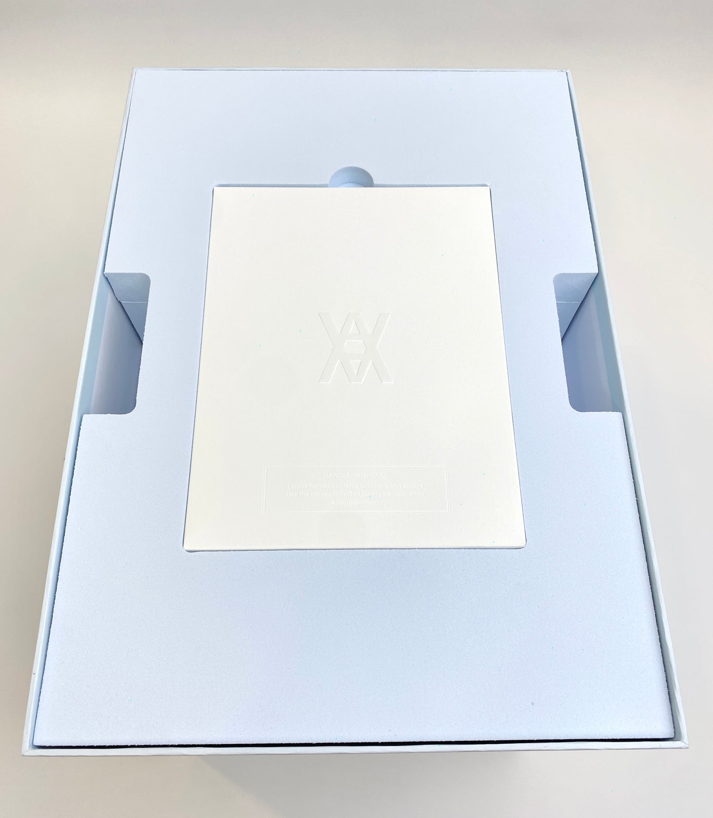 Daniel Arsham Crystalized Bulbasaur top of open box showing care glove box