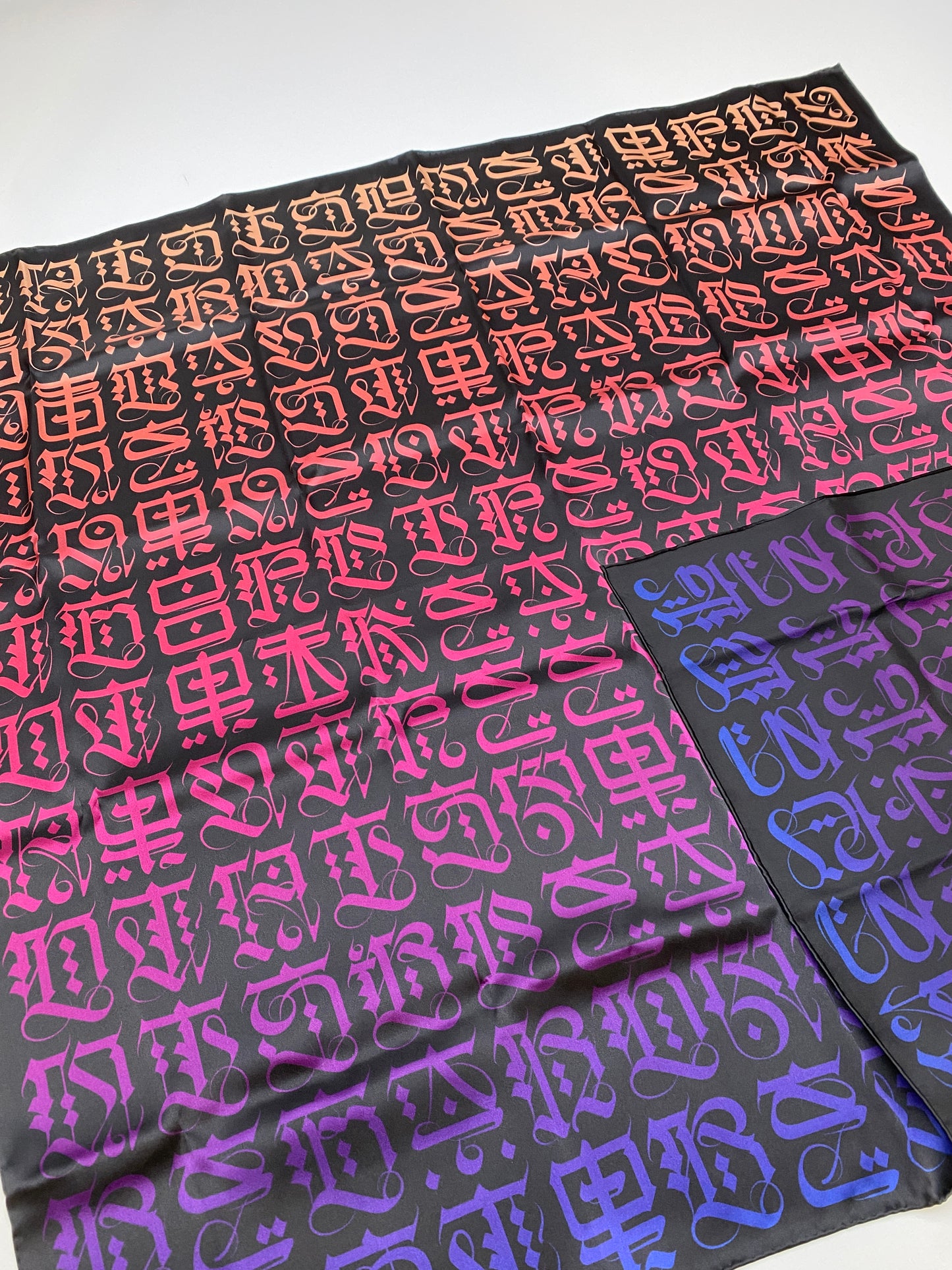 Cryptik LOVELETTER silk scarf opened laid down flat showing double-sided pattern