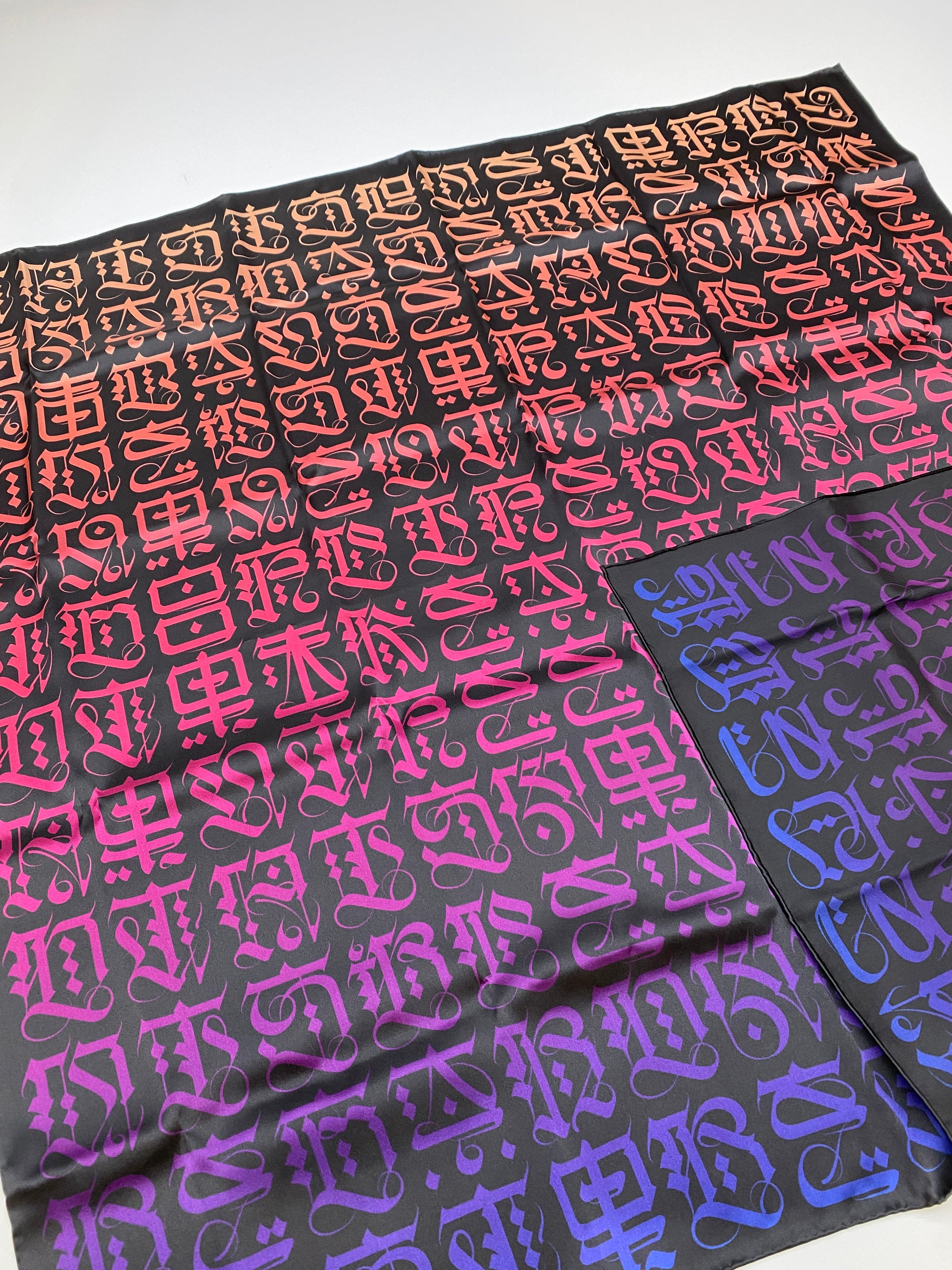 Cryptik LOVELETTER silk scarf opened laid down flat showing double-sided pattern