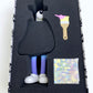 Steven Harrington Subconscious "Gradient" inside box showing vinyl figure, paint brush, and small canvas painting. 